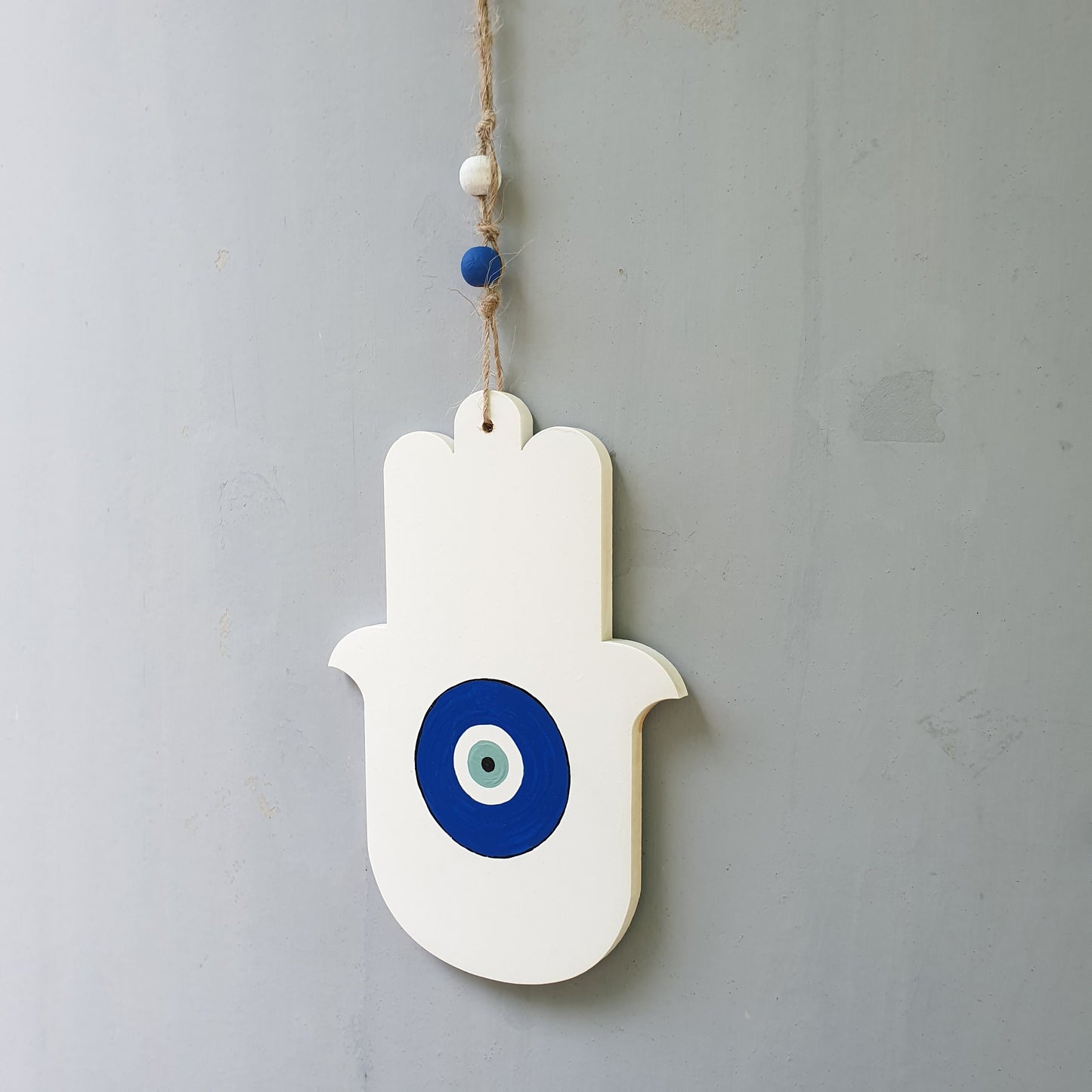 Astar | חמסה מעוצבת לקיר עם עין כחולה בעבודת יד